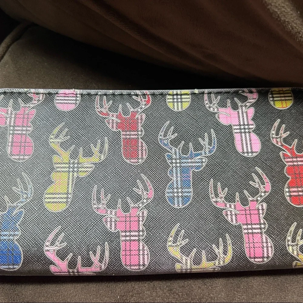 Simply southern wallet. Lots of slots for card and zips shut. Has some wear